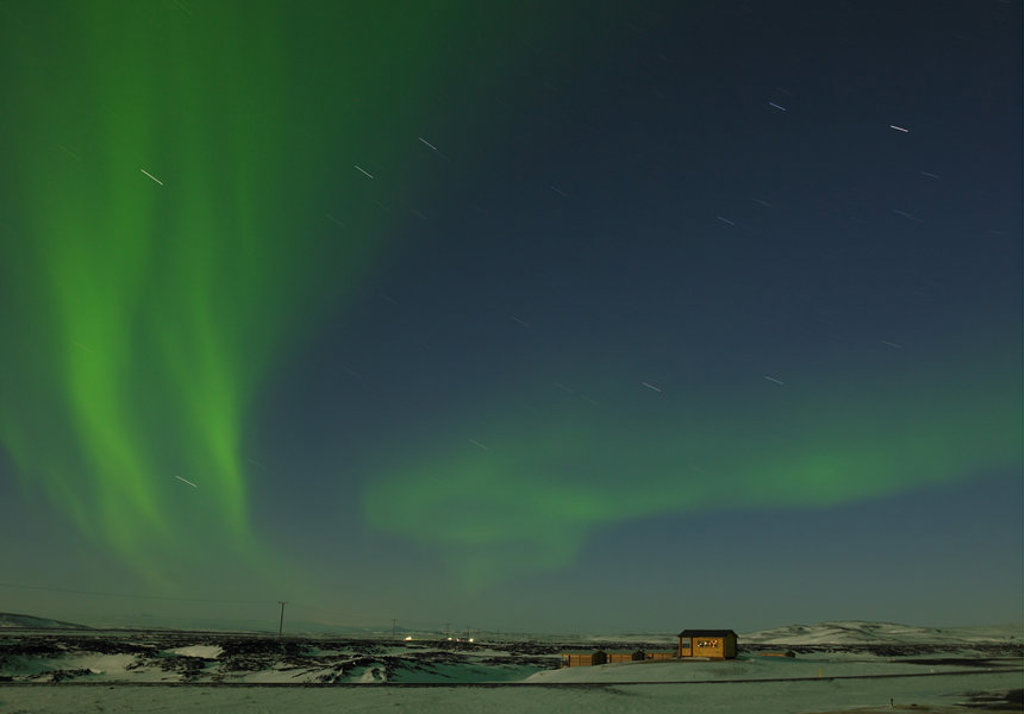 Noorderlicht boven een winters landschap in IJsland tijdens groepsrondreis IJsland Winter.